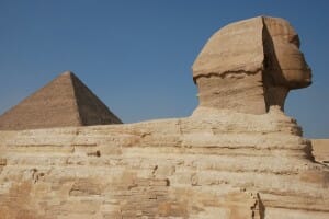 Sphinx with pyramid in background